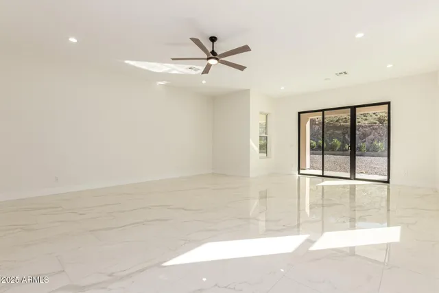 a spacious bathroom with a tub sink and mirror