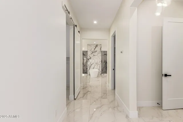 a view of a white house with a road