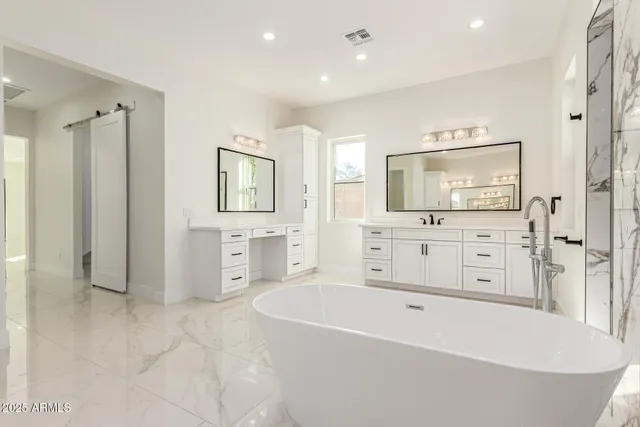 a bathroom with a double vanity sink and a mirror