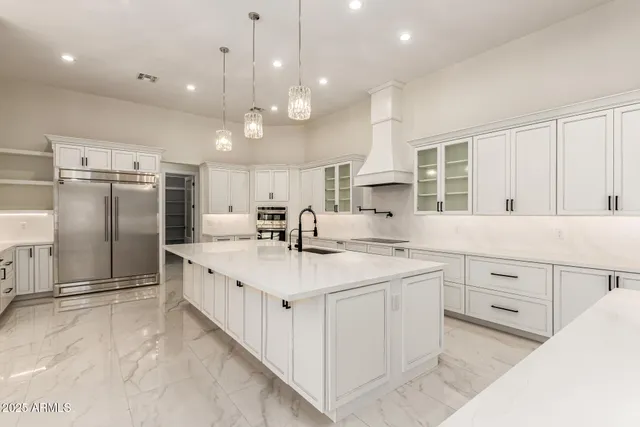 a kitchen with counter top space cabinets and stainless steel appliances
