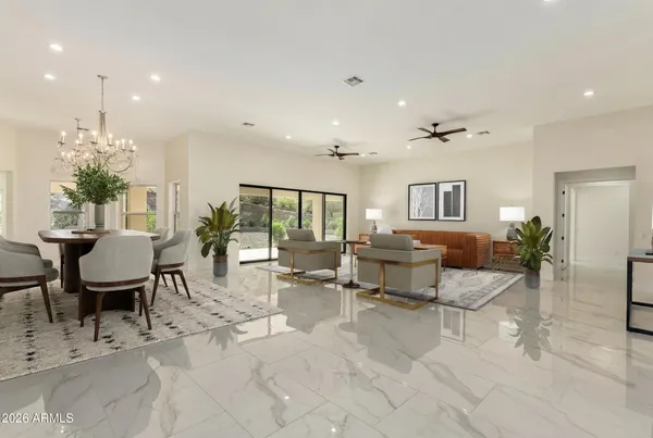 a dining room with furniture and window