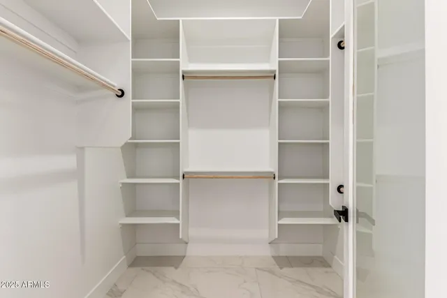 a bathroom with a double vanity sink and mirror with window