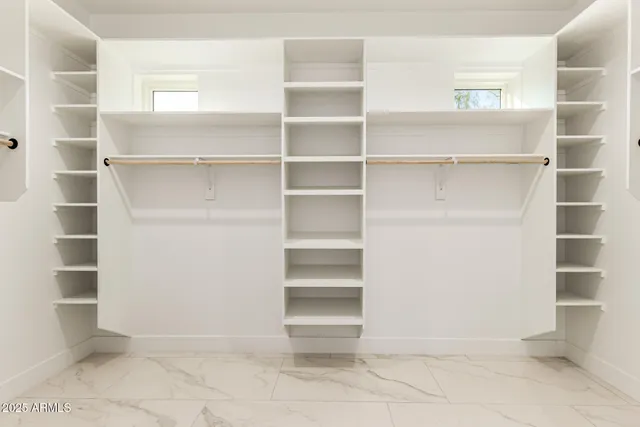 a bathroom with a toilet sink and a shower