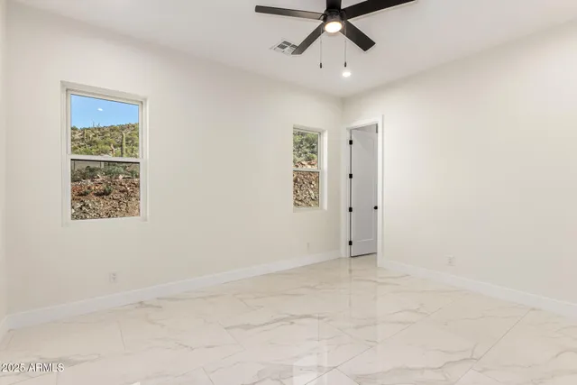 a bathroom with a double vanity sink mirror and shower