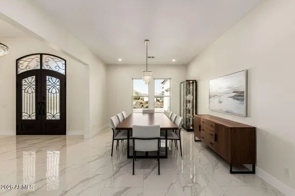 a kitchen with kitchen island a sink counter and chairs