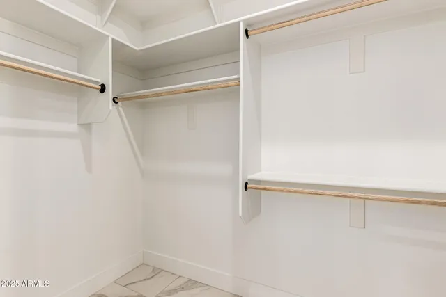 an aerial view of a house with a yard and sitting space