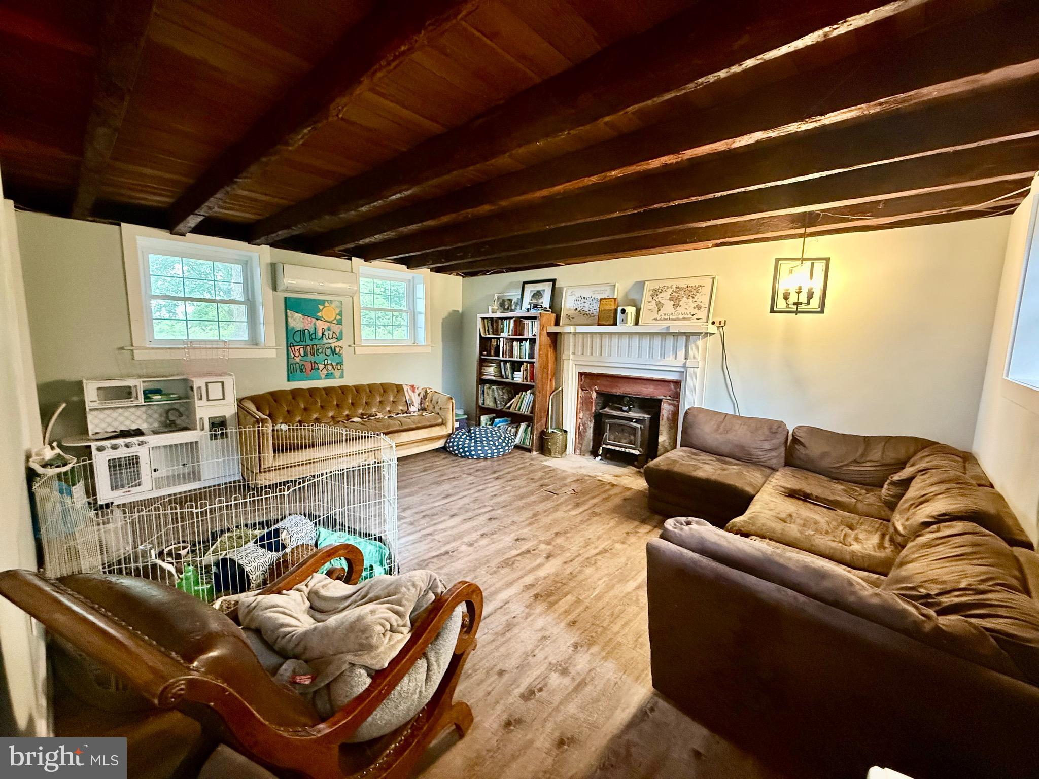 2349 Skinkers Neck Road Rappahannock Academy, VA 22538 - Photo 57 of 71 a living room with furniture and a fireplace