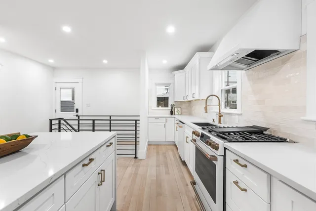 a kitchen with cabinets and appliances