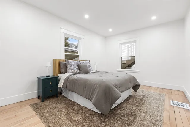 a bedroom with a bed and window