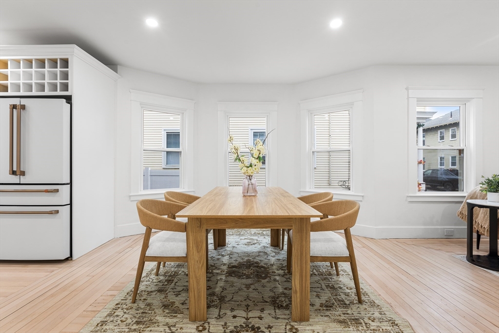 22 Prescott Street, Unit 1 Salem, MA 01970 - Photo 8 of 38 a view of a dining room with furniture and wooden floor