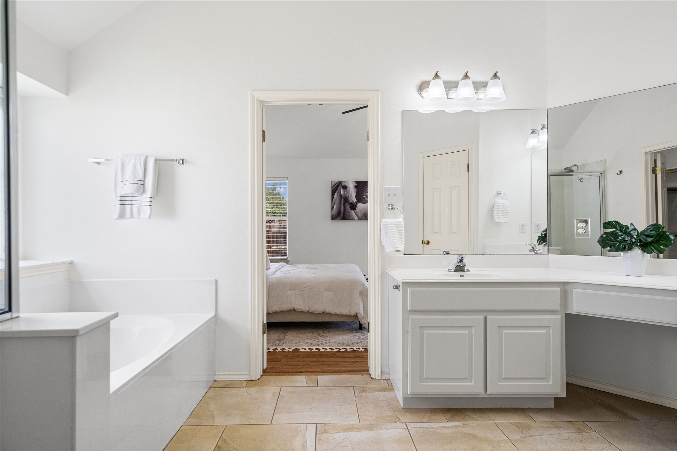 2920 Warwick Way Austin, TX 78748 - Photo 22 of 36 Spacious and bright primary bathroom with walk-in closet, dual vanities, garden tub, and separate shower