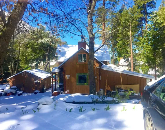 a view of house with backyard space and garden