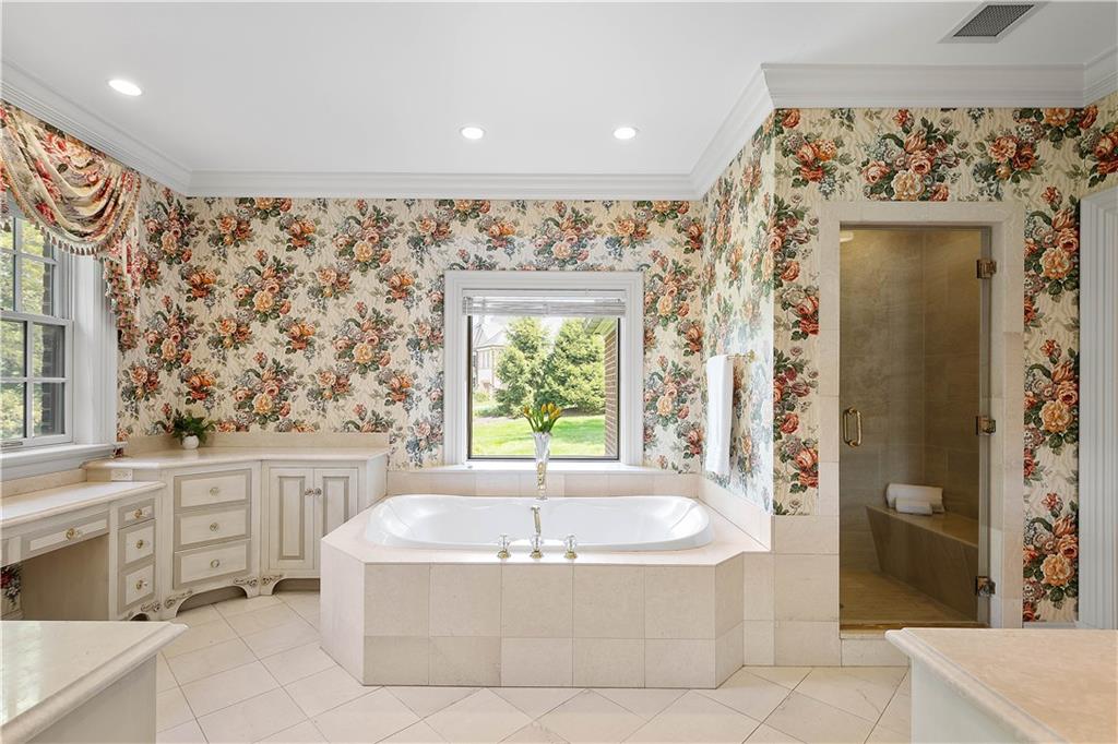 125 Froebe Road Venetia, PA 15367 - Photo 25 of 50 a bath tub sitting in a bathroom next to a window