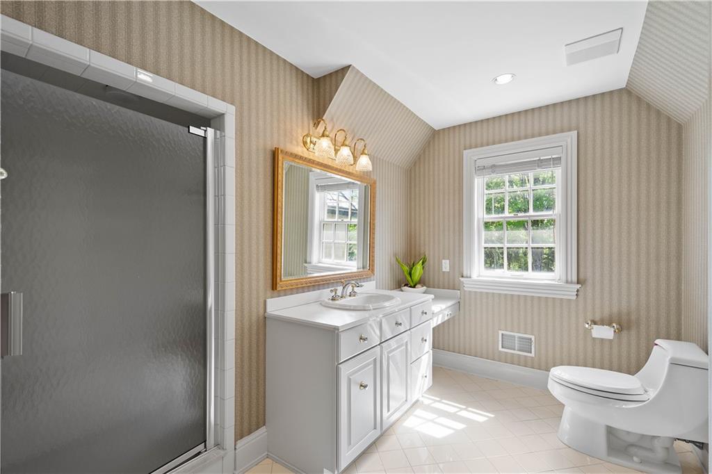 125 Froebe Road Venetia, PA 15367 - Photo 34 of 50 a bathroom with a sink a toilet a mirror and a window