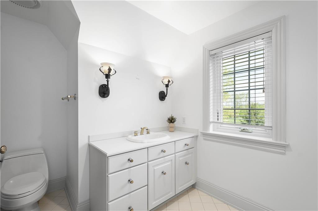 125 Froebe Road Venetia, PA 15367 - Photo 36 of 50 a spacious bathroom with a toilet sink and mirror