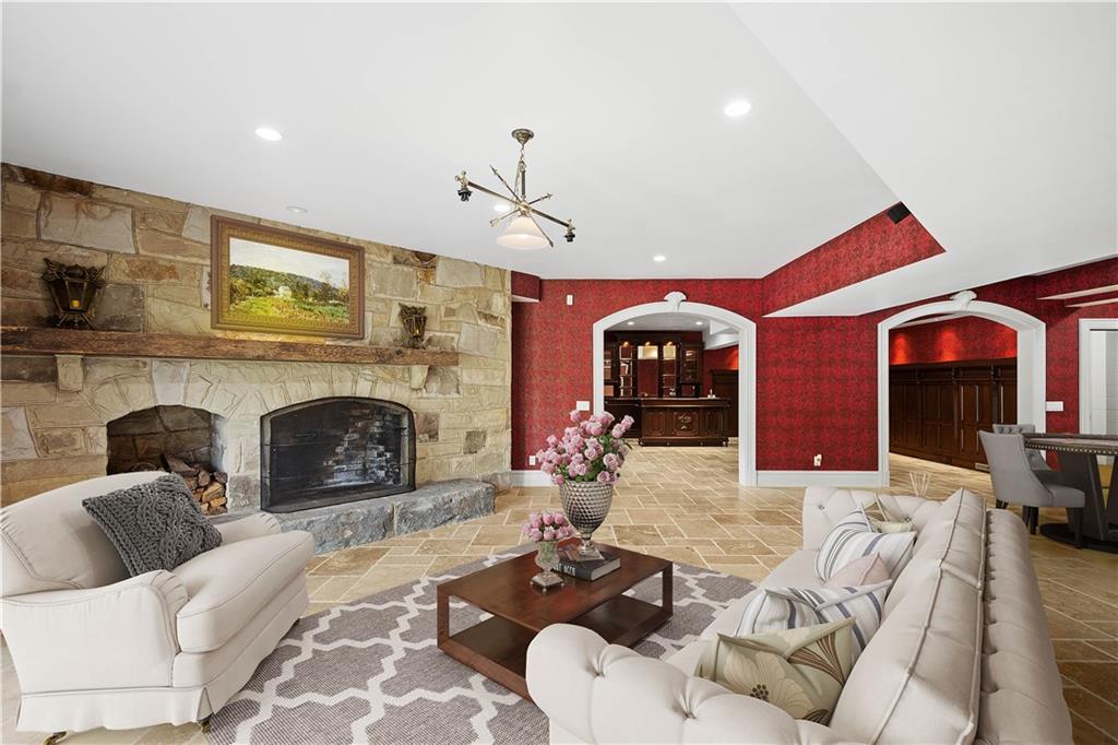 125 Froebe Road Venetia, PA 15367 - Photo 46 of 50 a living room with furniture and a fireplace