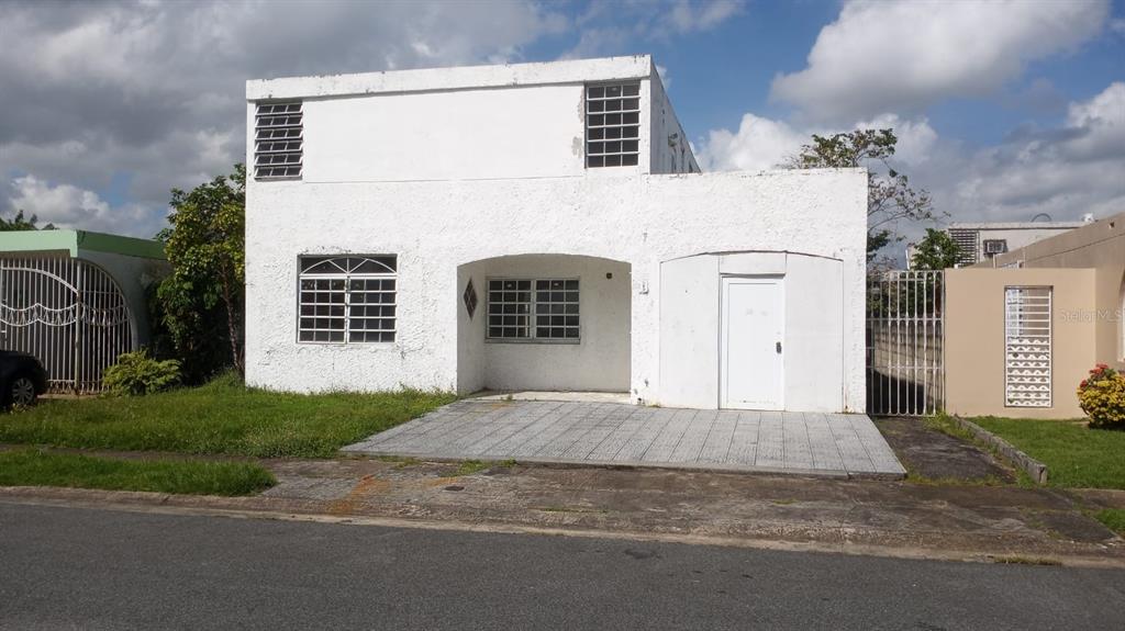 3 Urb Estancias De Rio Hondo I Rio Casey Street Bayamon, PR 00961 - Photo 1 of 1 a house that has a window in front of it