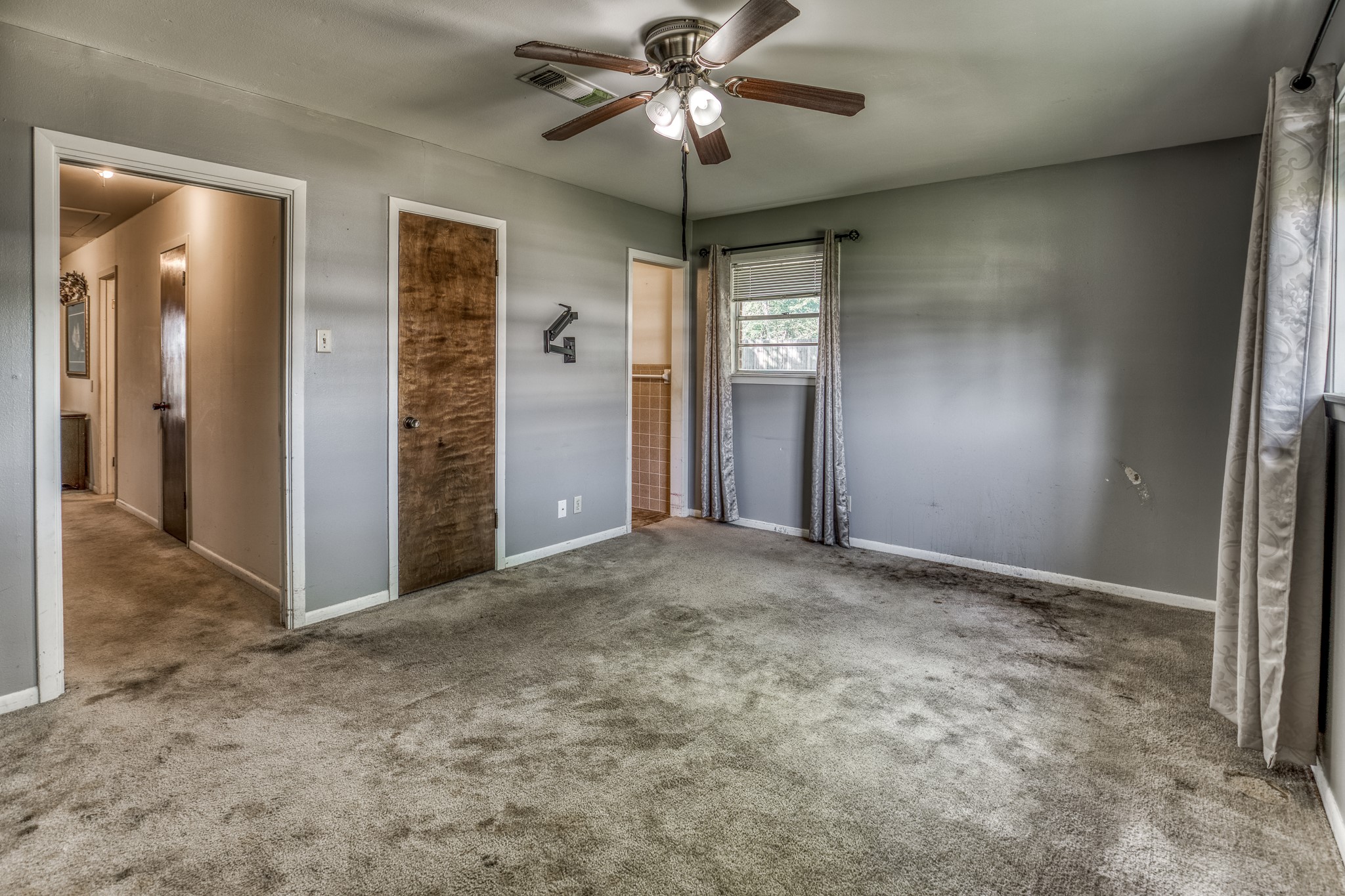 1687 Eagle Lake Road Sealy, TX 77474 - Photo 22 of 27 an empty room with closet and a chandelier fan