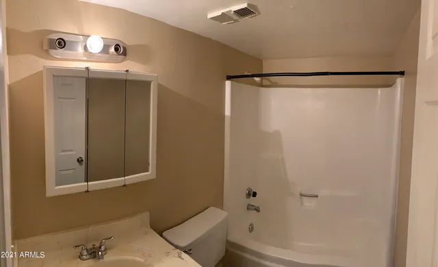 a bathroom with a bathtub and shower