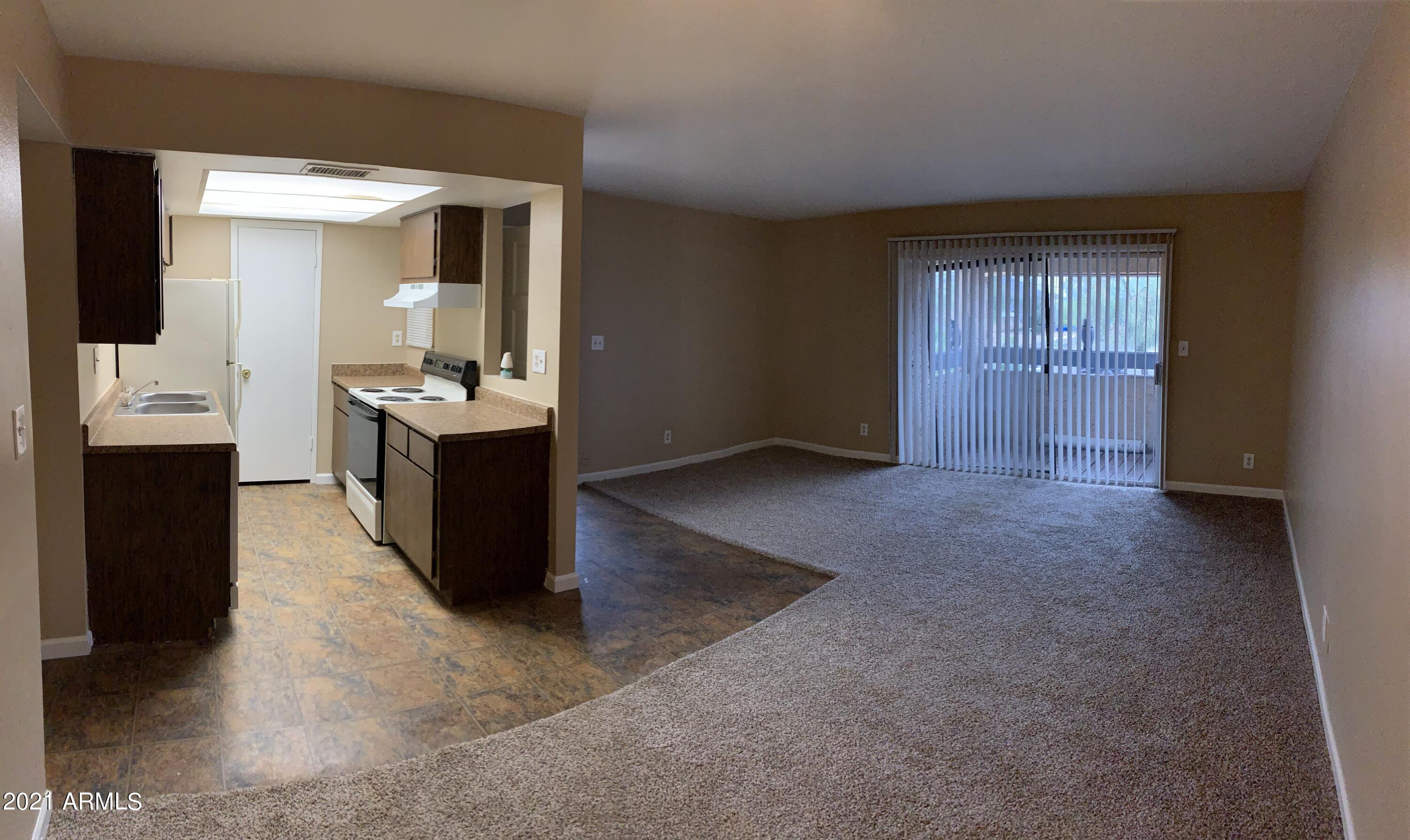 2217 East Cactus Road, Unit 4 Phoenix, AZ 85022 - Photo 7 of 14 a view of a kitchen cabinets and a kitchen
