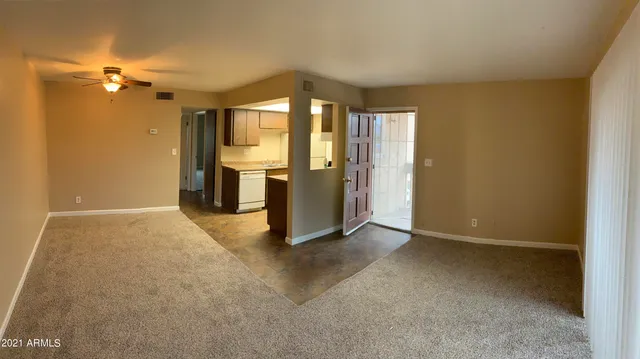 a view of an empty room with a window