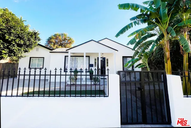 a view of a wrought iron fences in front of house