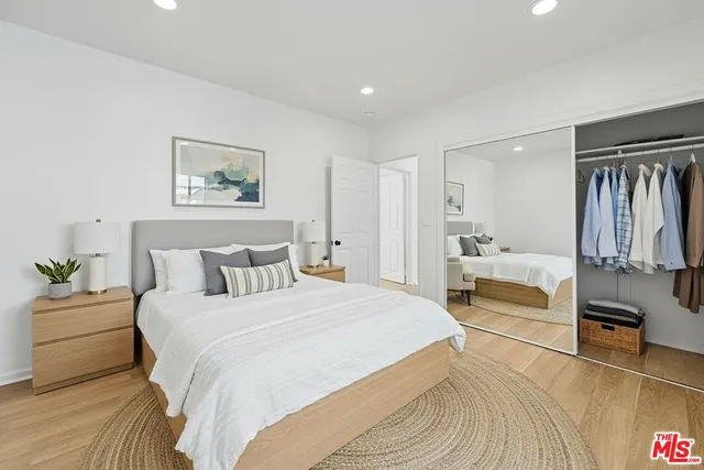 a bedroom with a bed and a couch