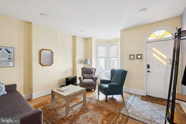 a living room with furniture and a window