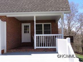 331 Raccoon Point Canton, NC 28716 - Photo 22 of 24 a view of a brick house with wooden floor