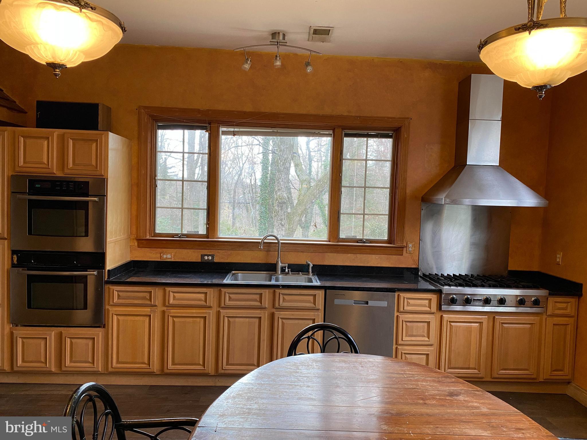 2601 Cool Spring Road Adelphi, MD 20783 - Photo 5 of 22 a kitchen with granite countertop a stove a sink and a microwave
