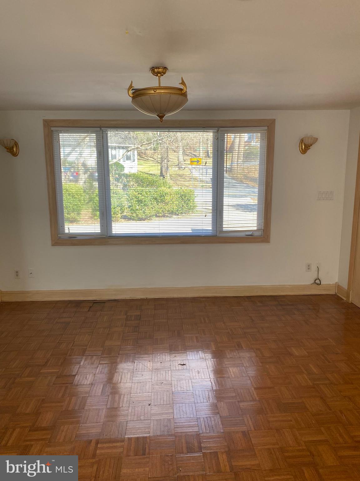 2601 Cool Spring Road Adelphi, MD 20783 - Photo 9 of 22 a view of an empty room with wooden floor and a window