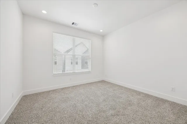 a spacious bathroom with a double vanity sink mirror and shower