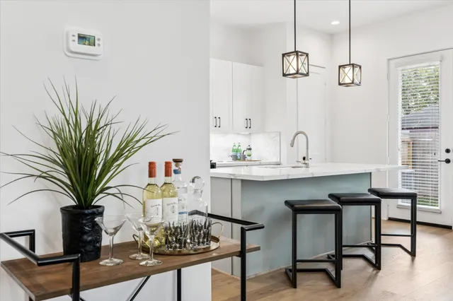 a kitchen with a table and chairs in it