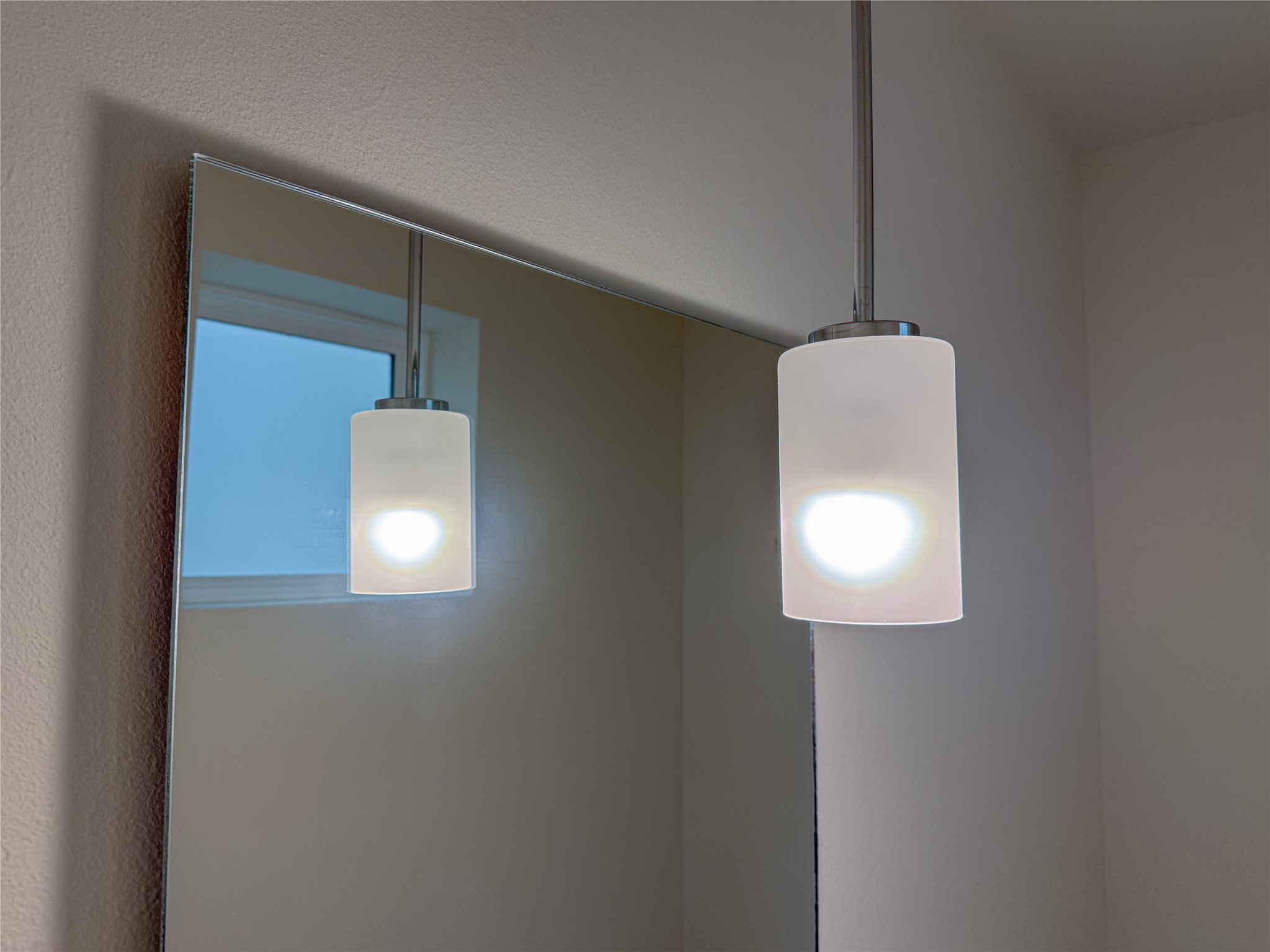 879 Rachel Street, Unit F Houston, TX 77091 - Photo 11 of 23 a bathroom with a light fixture and a mirror