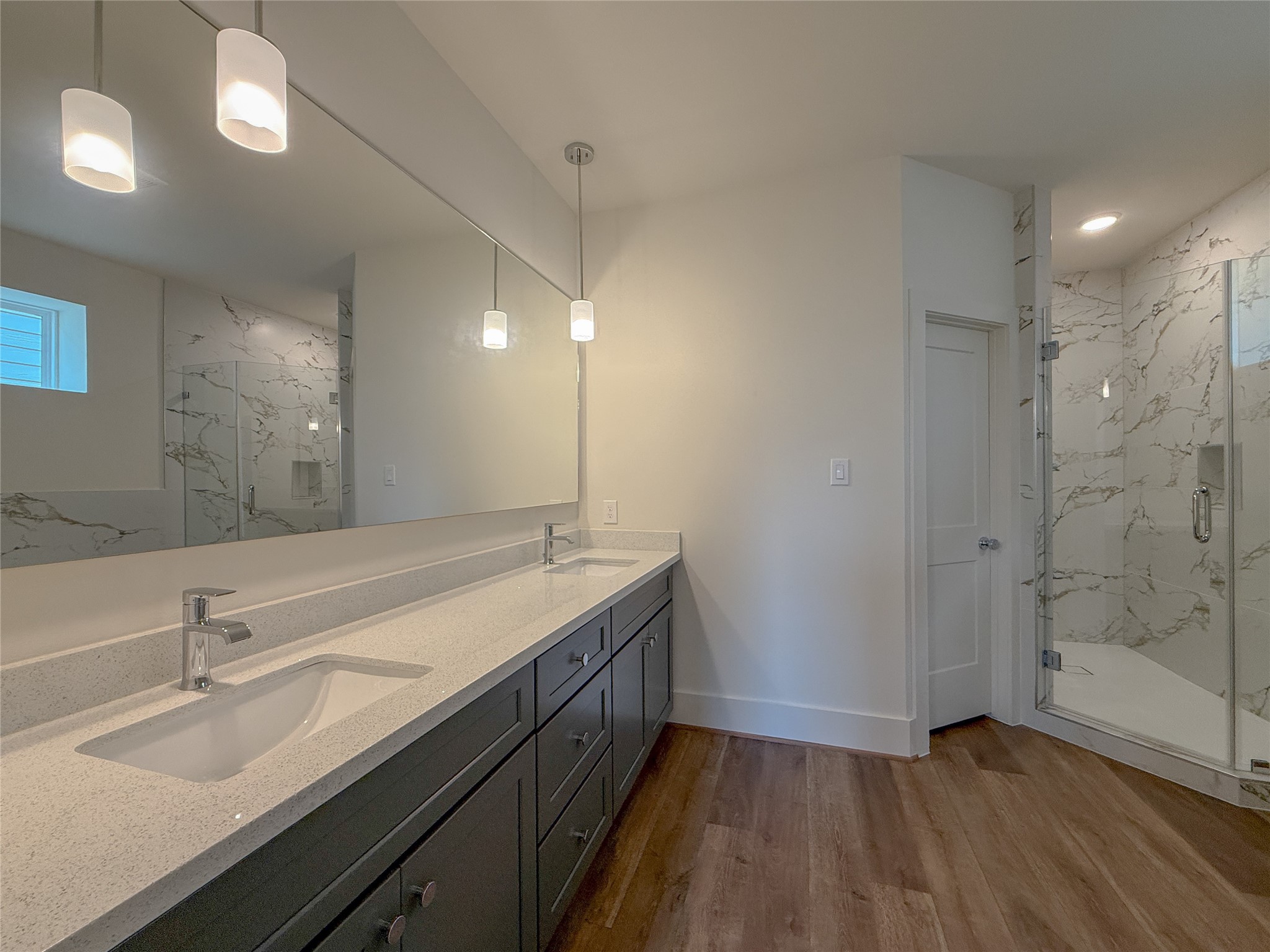 879 Rachel Street, Unit F Houston, TX 77091 - Photo 14 of 23 a bathroom with a double vanity sink mirror and shower