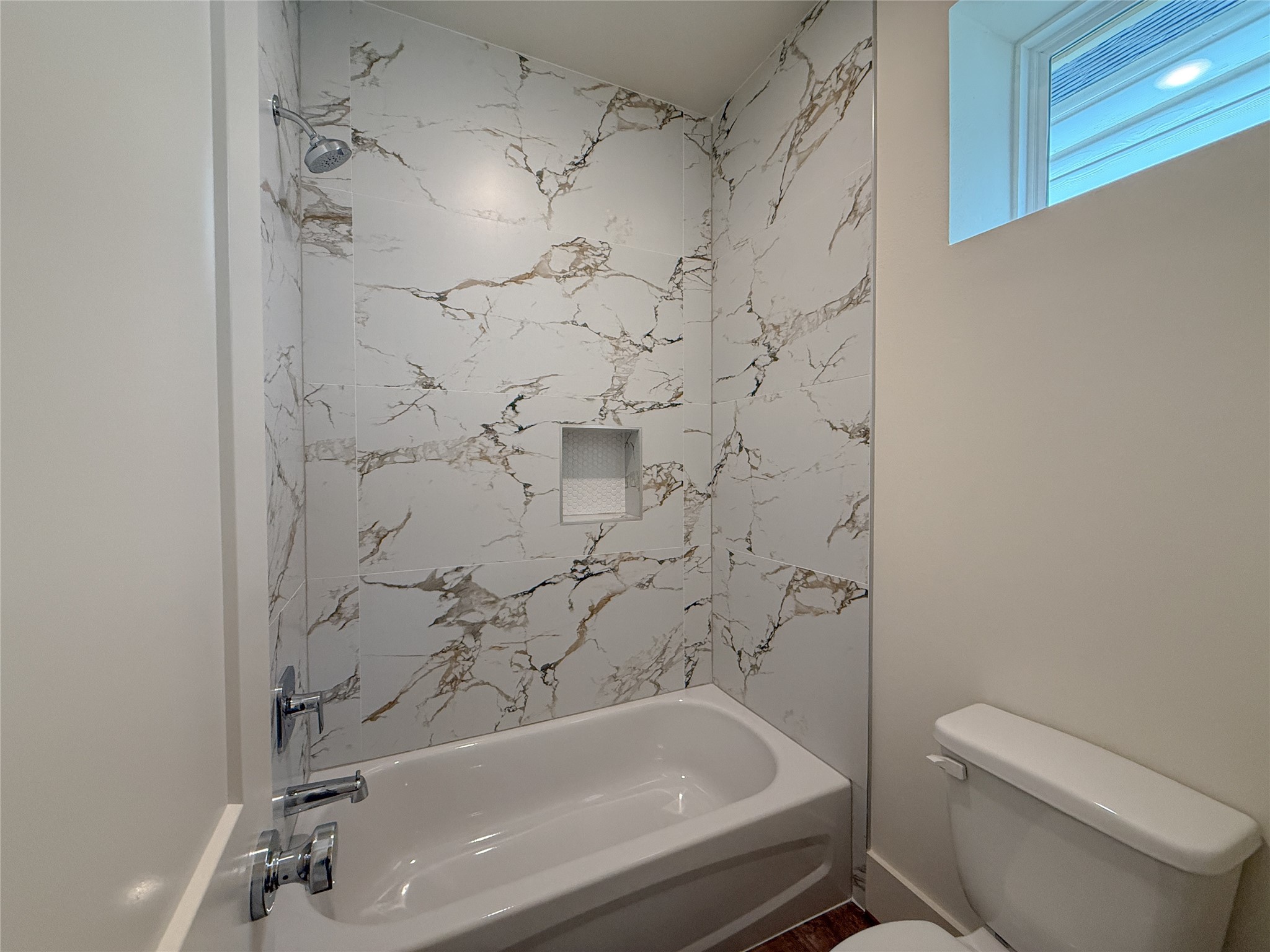 879 Rachel Street, Unit F Houston, TX 77091 - Photo 19 of 23 a bathroom with a shower and toilet