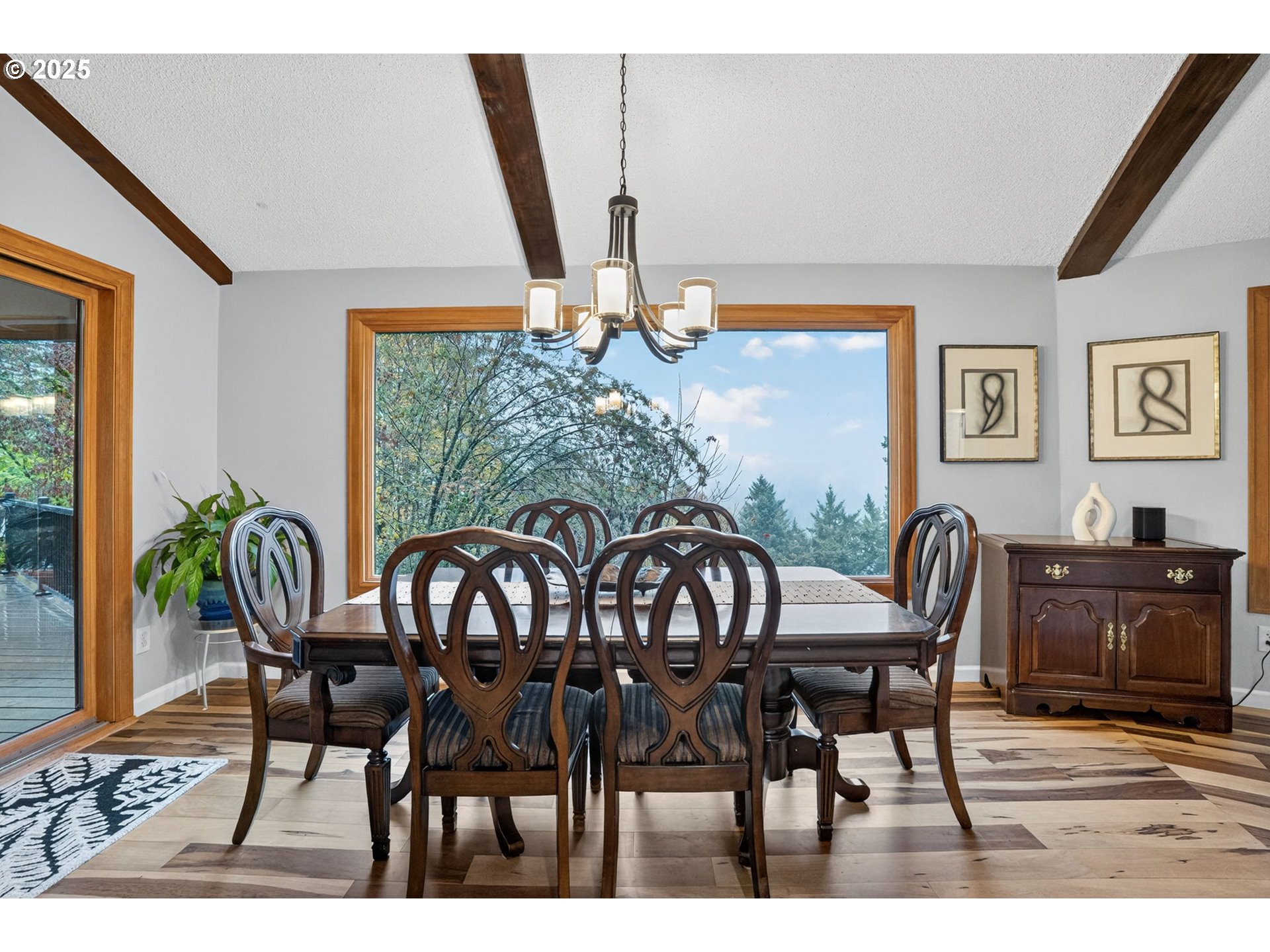 17542 Kirkwood Road Gladstone, OR 97027 - Photo 13 of 48 a view of a dining room with furniture window and wooden floor