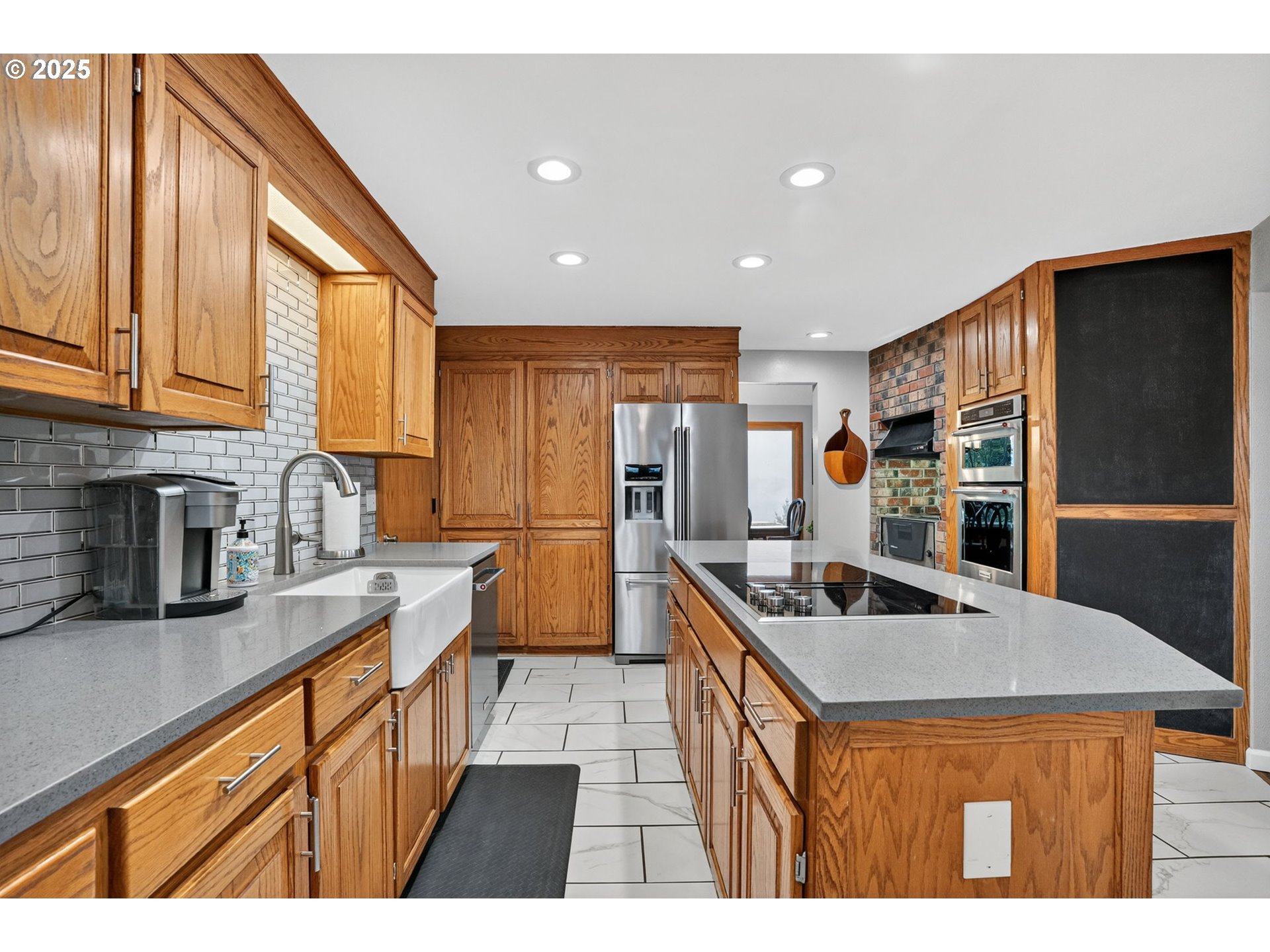 17542 Kirkwood Road Gladstone, OR 97027 - Photo 17 of 48 a kitchen with stainless steel appliances granite countertop a sink stove and refrigerator