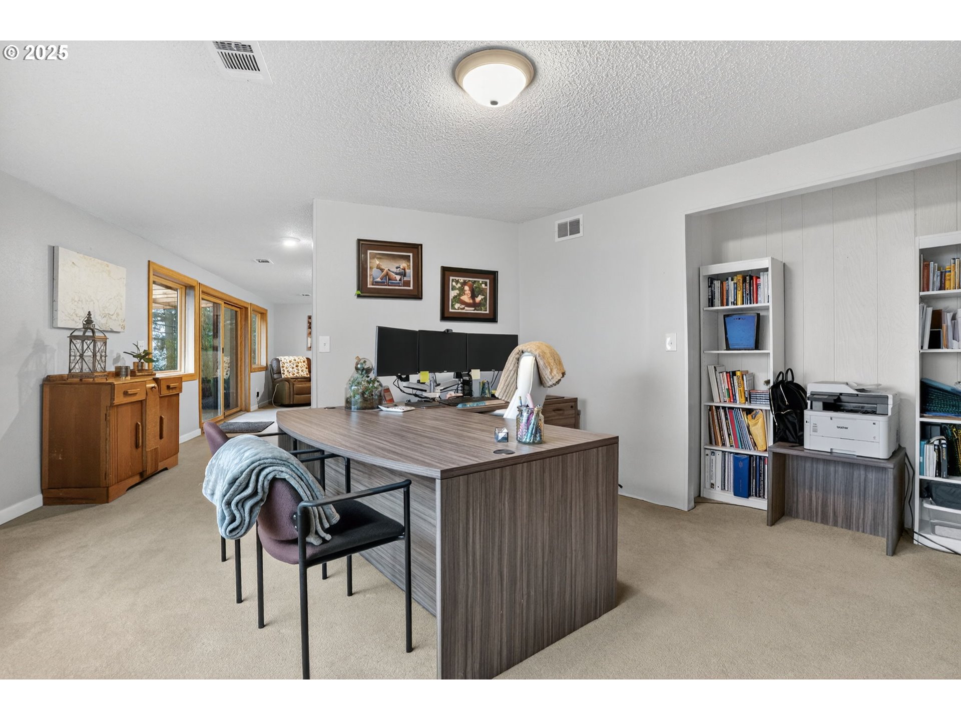 17542 Kirkwood Road Gladstone, OR 97027 - Photo 31 of 48 a living room with furniture and a flat screen tv