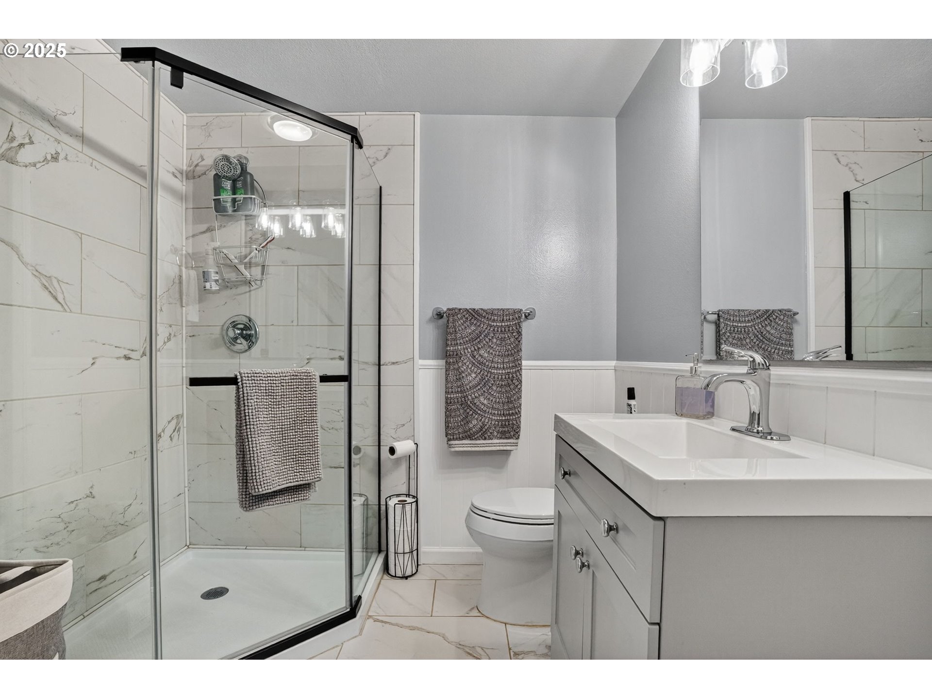 17542 Kirkwood Road Gladstone, OR 97027 - Photo 33 of 48 a bathroom with a shower sink vanity and mirror