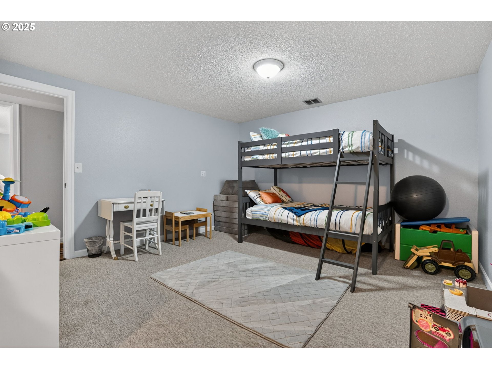 17542 Kirkwood Road Gladstone, OR 97027 - Photo 34 of 48 a bedroom with furniture and a wooden floor