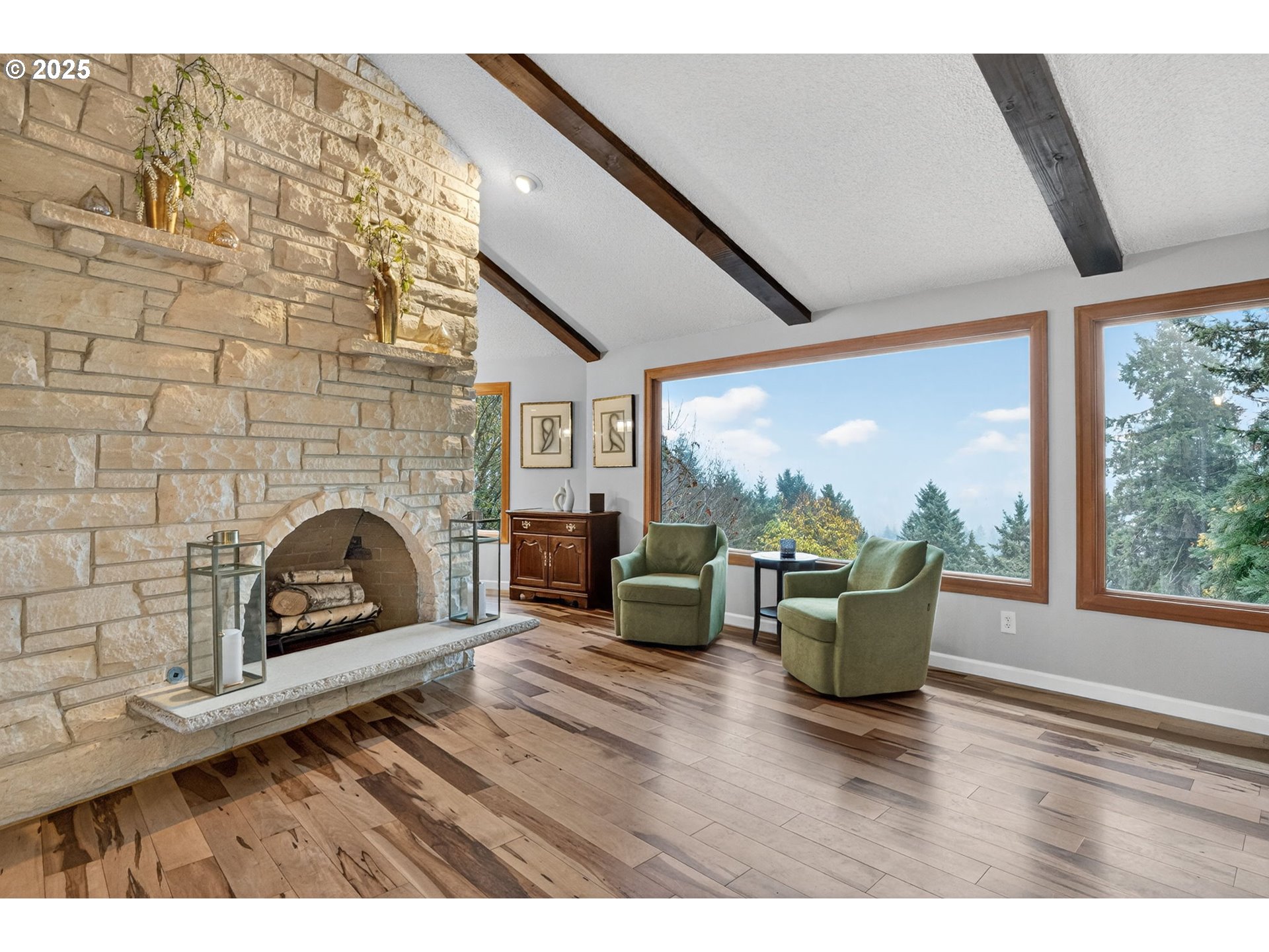 17542 Kirkwood Road Gladstone, OR 97027 - Photo 10 of 48 a living room with furniture floor to ceiling window and fireplace