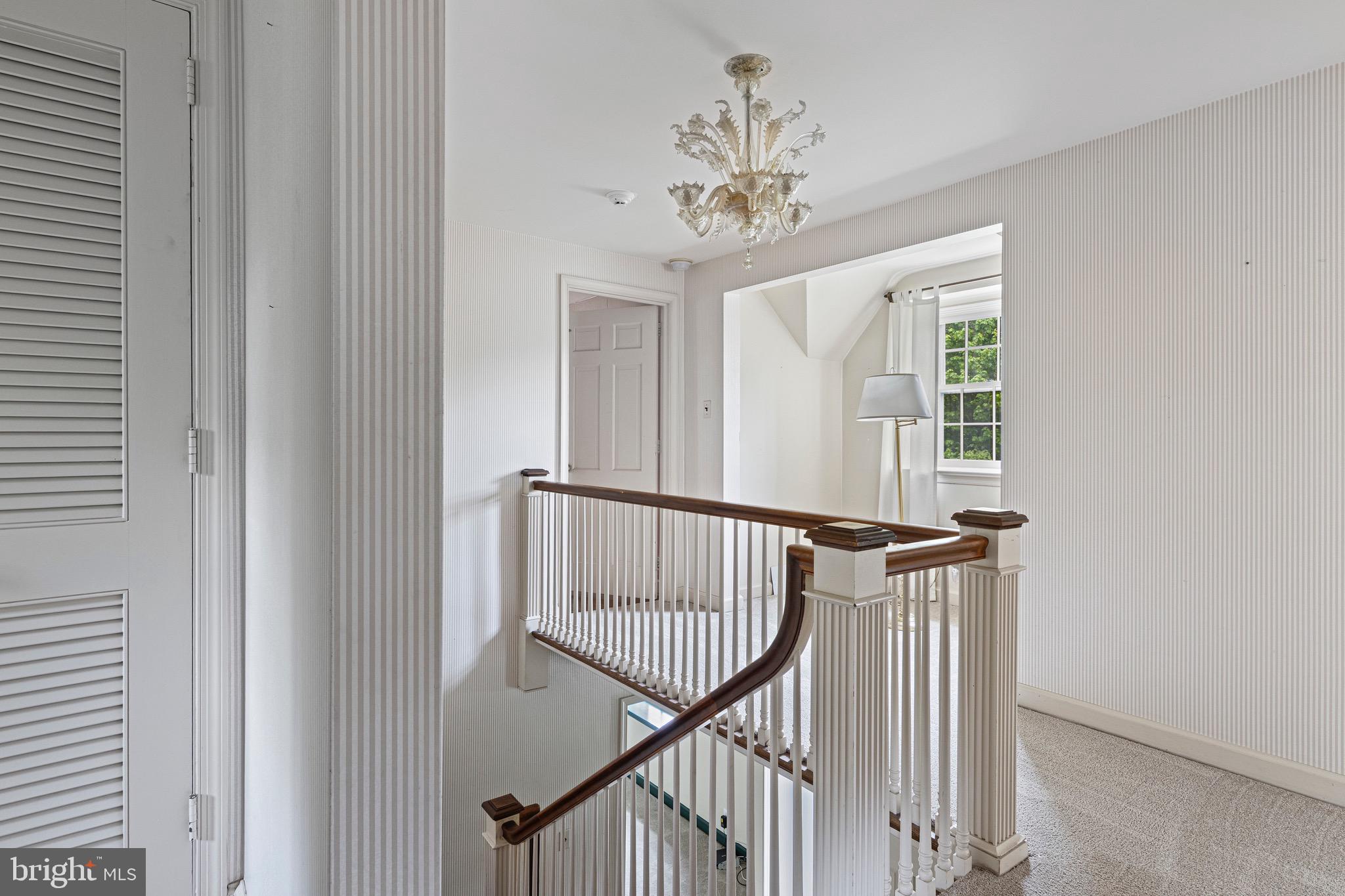71 Forest Lane Swarthmore, PA 19081 - Photo 20 of 33 a view of a hallway with windows and stairs