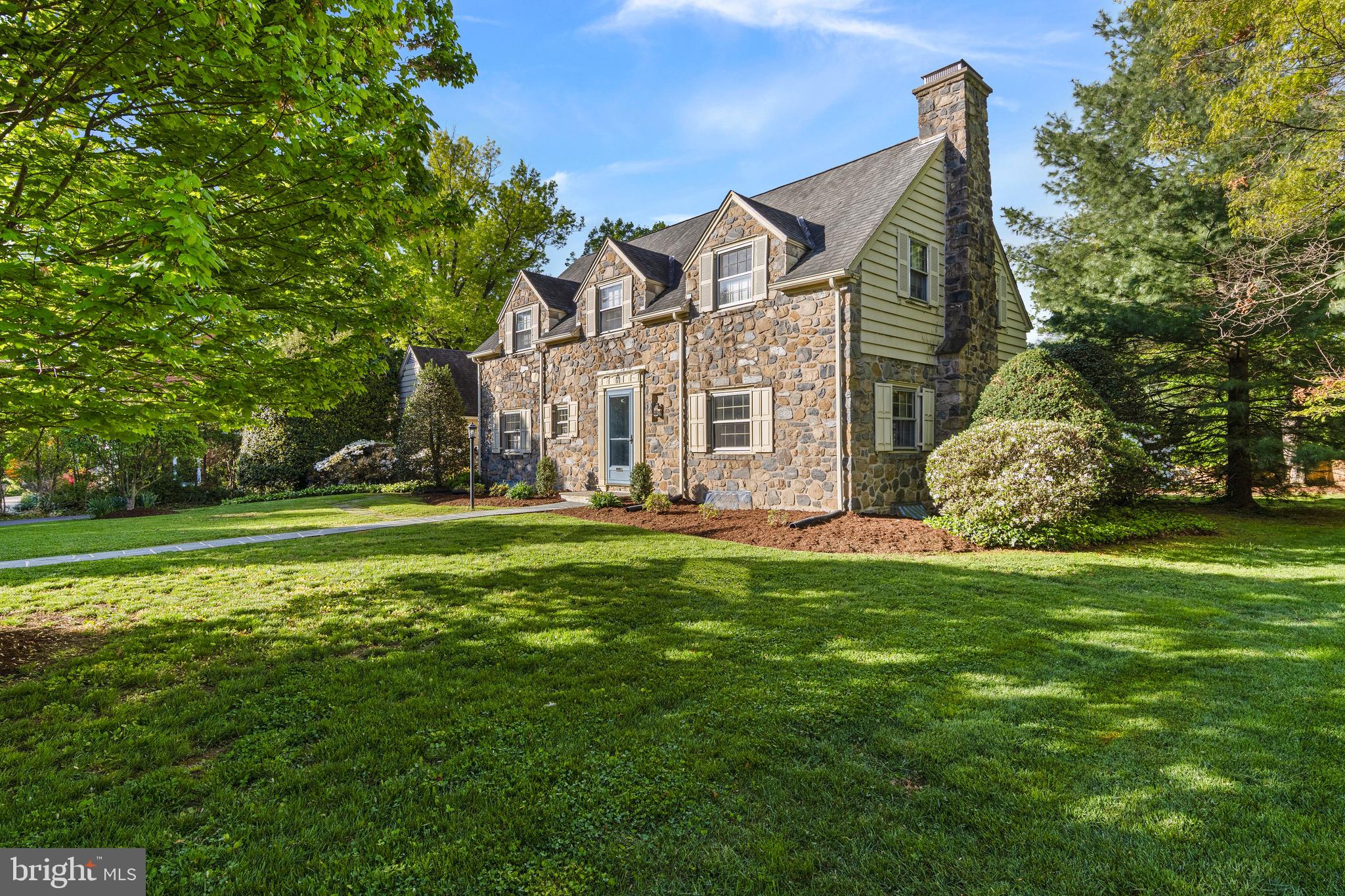 71 Forest Lane Swarthmore, PA 19081 - Photo 2 of 33 a view of a big house with a big yard and large trees