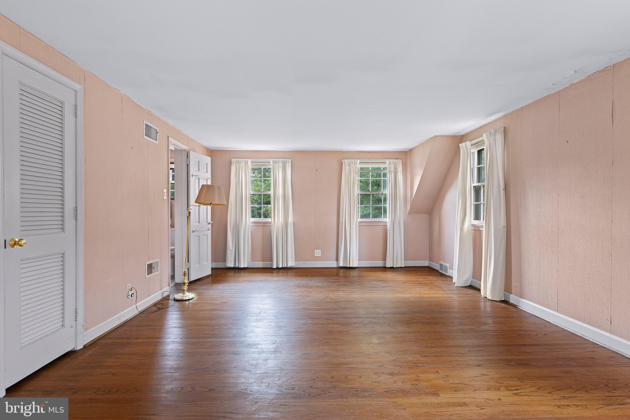 71 Forest Lane Swarthmore, PA 19081 - Photo 25 of 33 an empty room with wooden floor and windows
