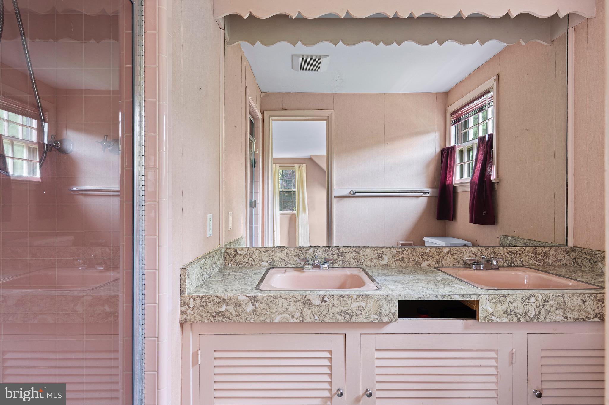 71 Forest Lane Swarthmore, PA 19081 - Photo 27 of 33 a bathroom with a granite countertop sink and a mirror