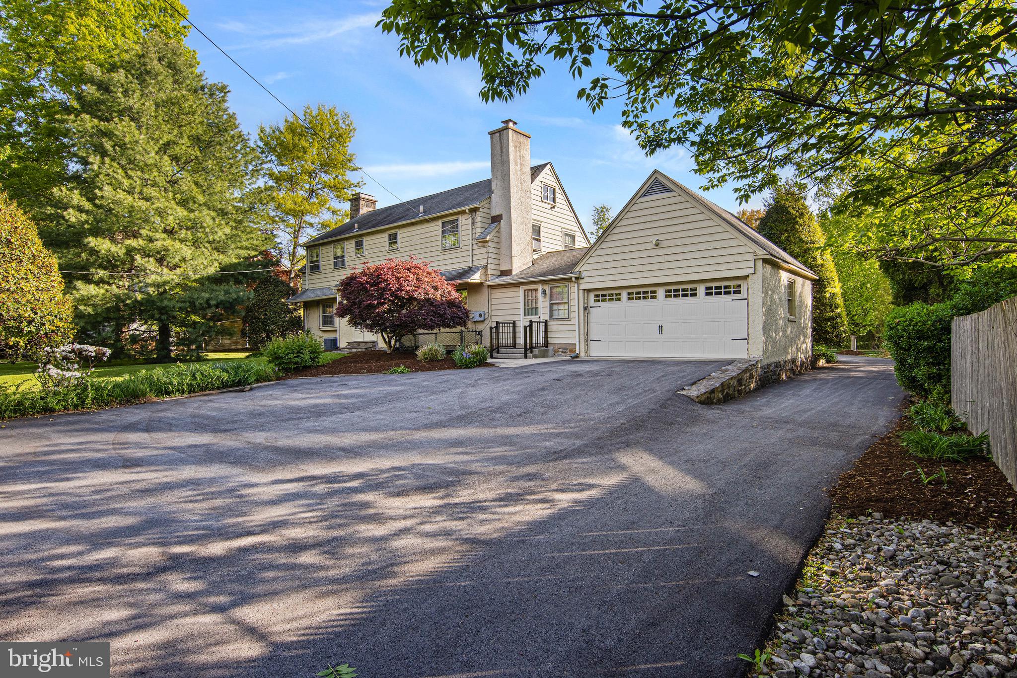 71 Forest Lane Swarthmore, PA 19081 - Photo 30 of 33 a view of a house with a yard and large trees