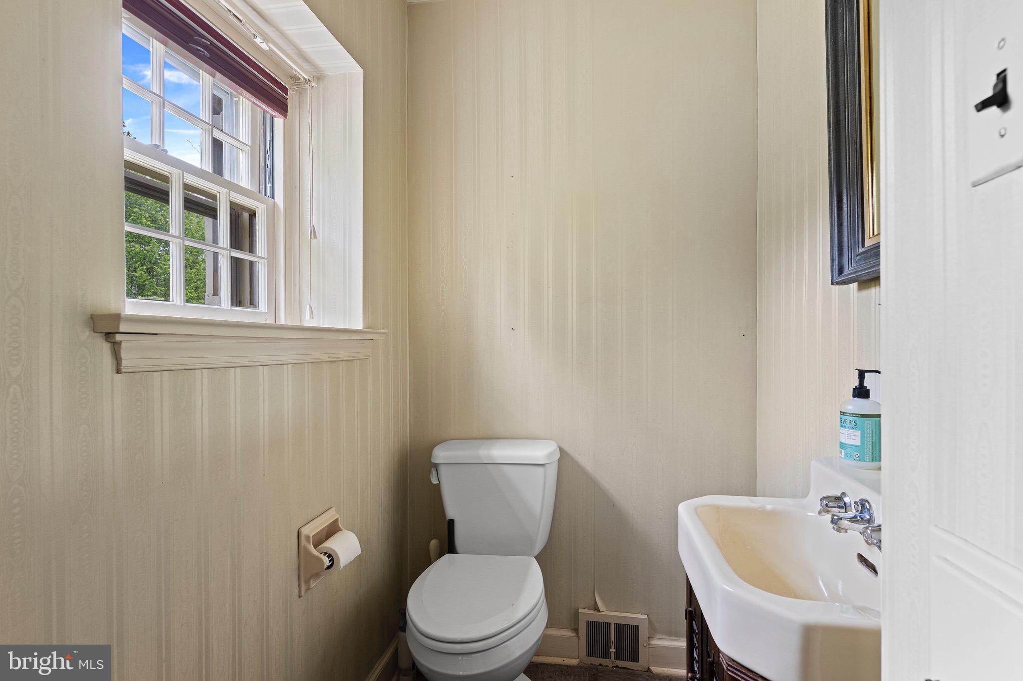 71 Forest Lane Swarthmore, PA 19081 - Photo 5 of 33 a white toilet sitting next to a bathroom sink
