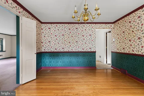 view of a room with wooden floor and window