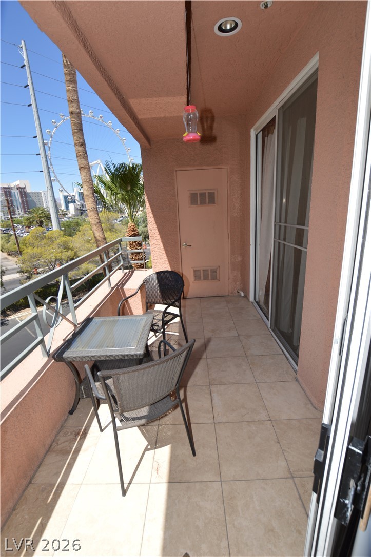 220 East Flamingo Road, Unit 327 Las Vegas, NV 89169 - Photo 3 of 13 Enjoy city views and vibrant outdoor living from this inviting balcony.